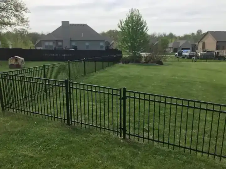 Black aluminium ornamental fence in a residential back garden
