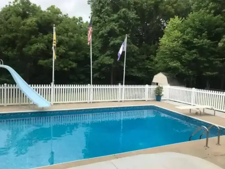 White vinyl picket pool enclosure, a second angle